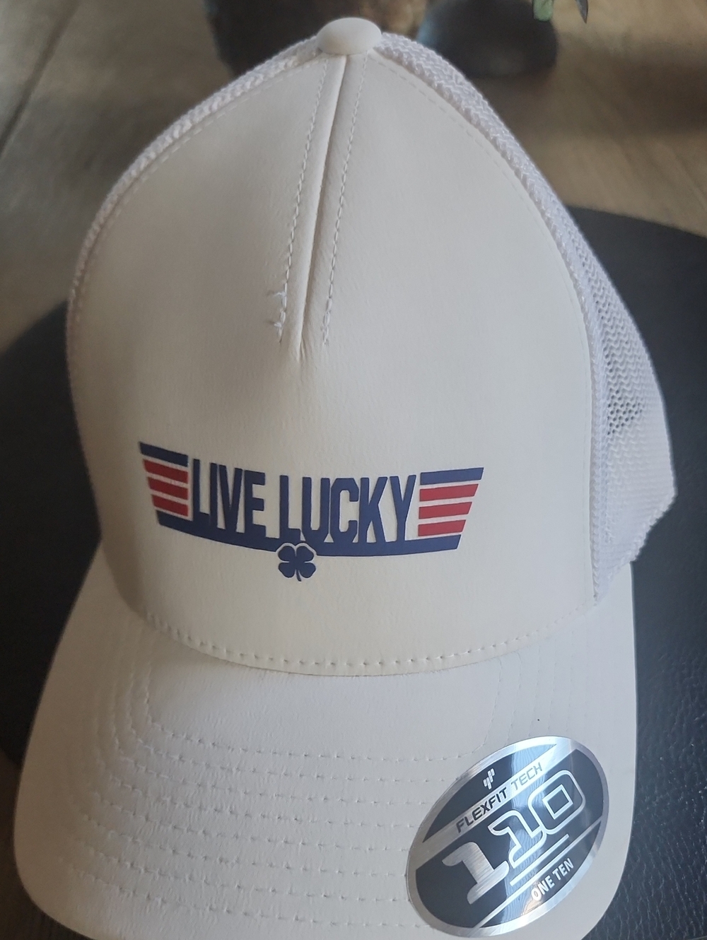 Black Clover Top Gun Snapback Cap featuring a blue "Live Lucky"